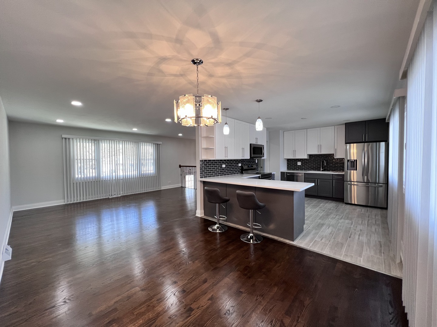 235 North Rohlwing Road Palatine, IL 60074 - Photo 8 of 35 a kitchen with a refrigerator and a stove top oven