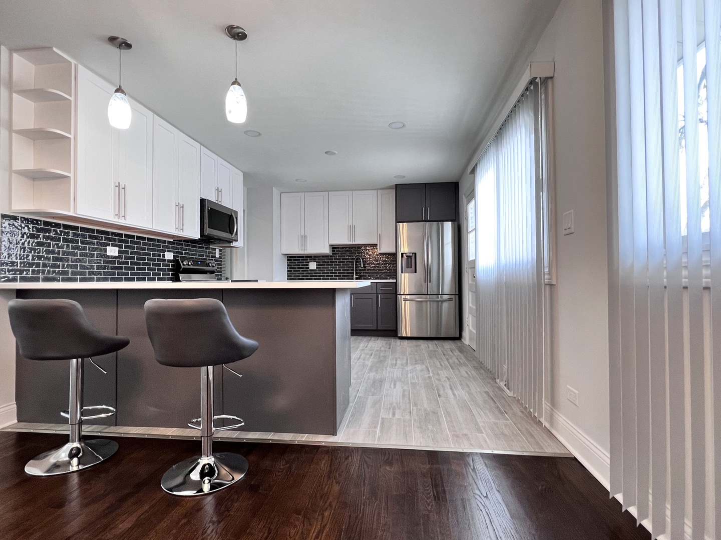 235 North Rohlwing Road Palatine, IL 60074 - Photo 10 of 35 a kitchen with stainless steel appliances granite countertop a refrigerator stove top oven and sink