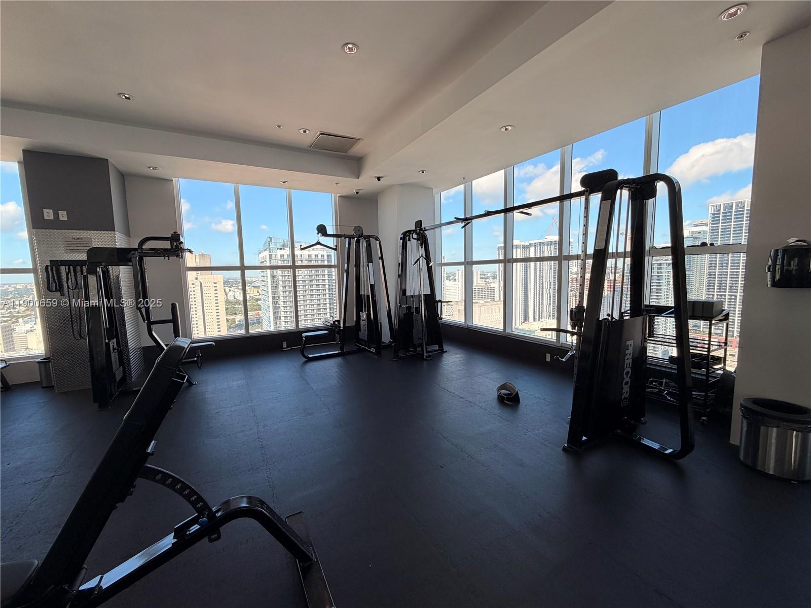 133 Northeast 2nd Avenue, Unit 209 Miami, FL 33132 - Photo 18 of 20 a view of an empty room with wooden floor and a window