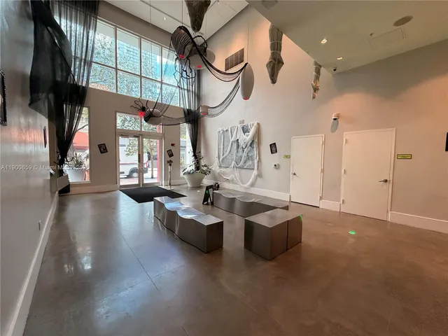 a living room with fireplace furniture and a flat screen tv