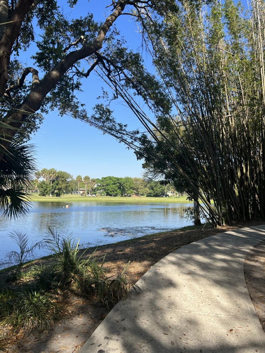 4361 West McNab Road, Unit 21 Pompano Beach, FL 33069 - Photo 11 of 18 a view of lake with green space