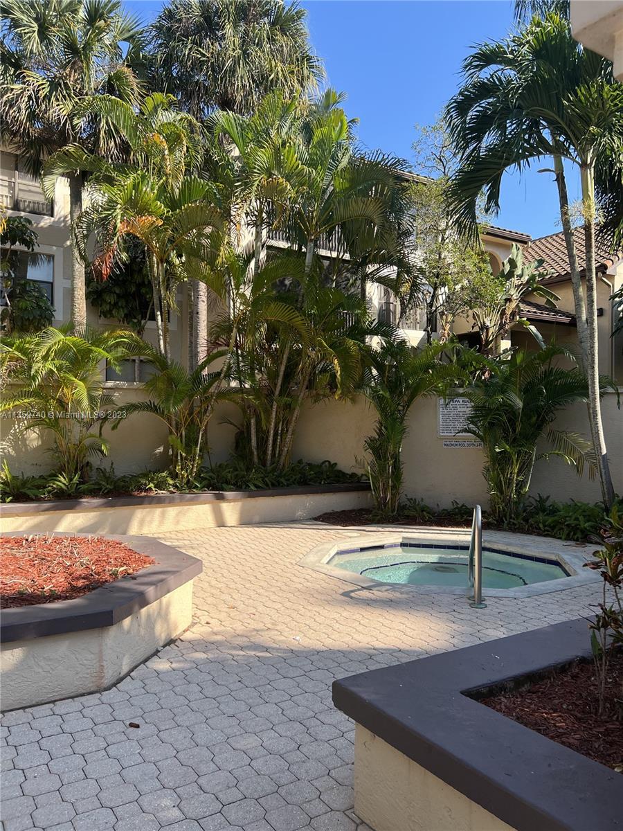 4361 West McNab Road, Unit 21 Pompano Beach, FL 33069 - Photo 3 of 18 a view of a backyard