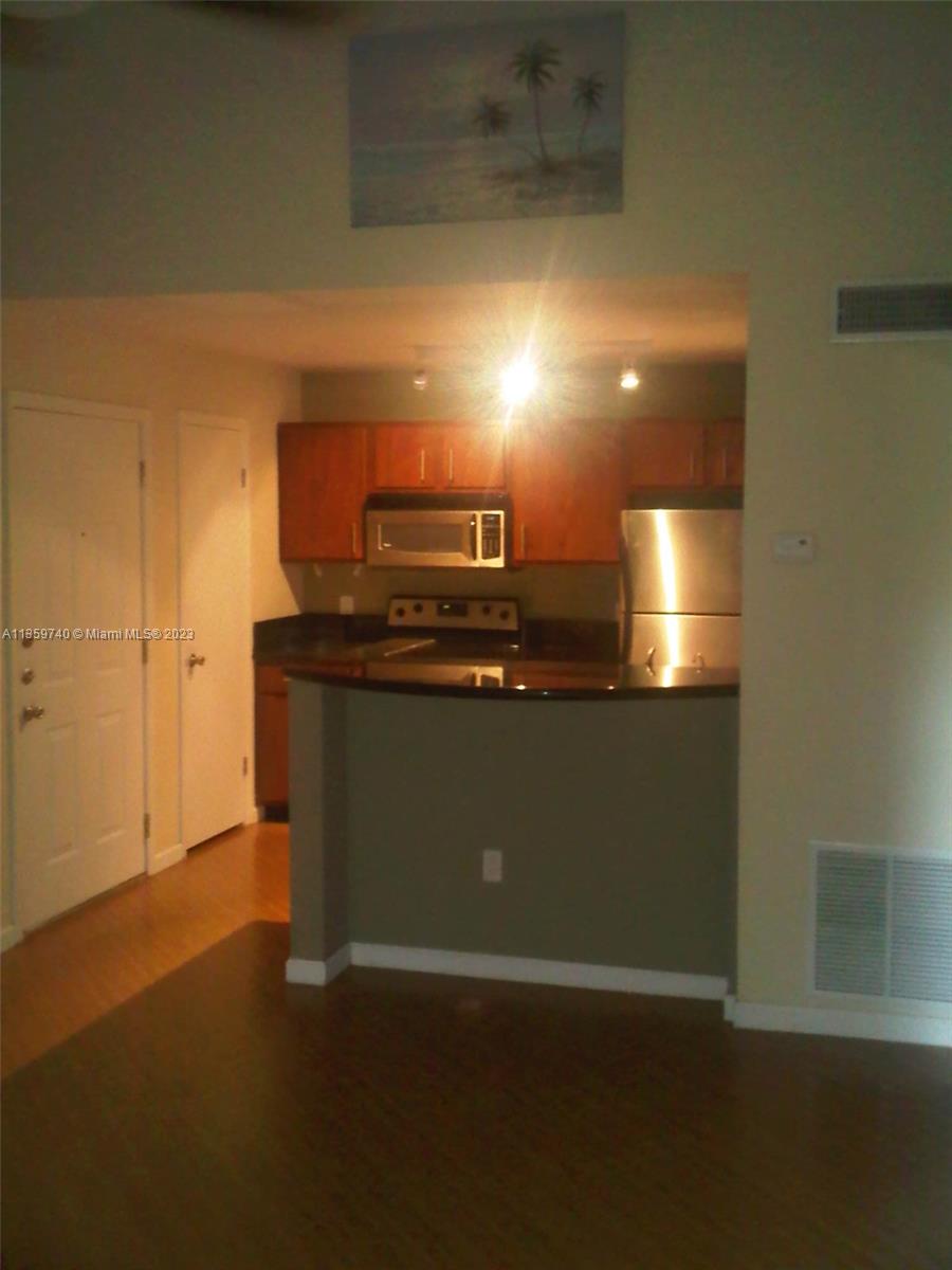 4361 West McNab Road, Unit 21 Pompano Beach, FL 33069 - Photo 5 of 18 a view of a kitchen with a sink