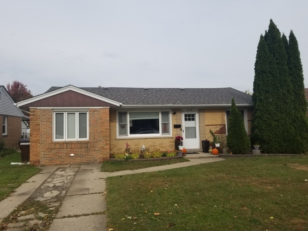 6110 Birmingham Street Chicago Ridge, IL 60415 - Photo 1 of 20 a front view of a house with a yard