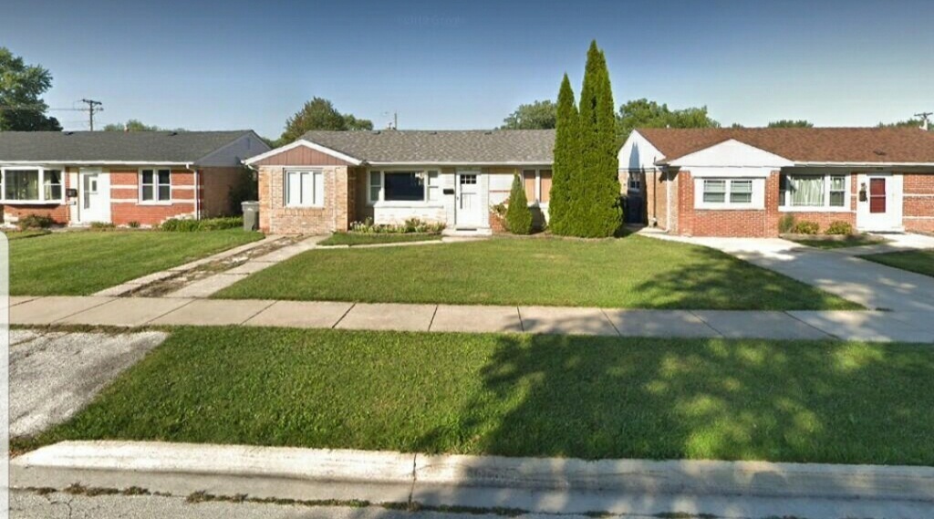 6110 Birmingham Street Chicago Ridge, IL 60415 - Photo 2 of 20 a front view of a house with a yard