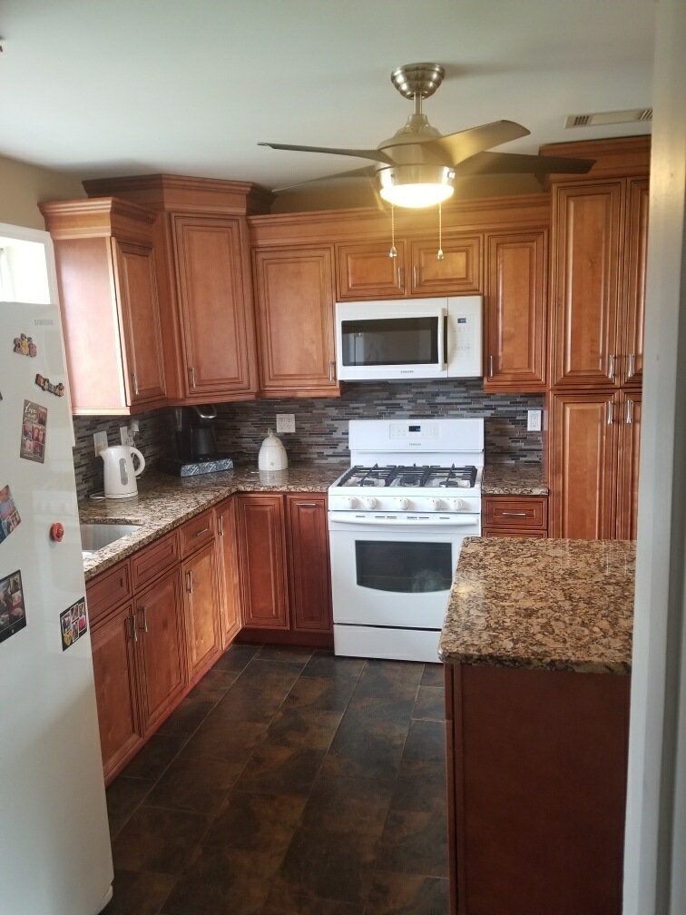 6110 Birmingham Street Chicago Ridge, IL 60415 - Photo 14 of 20 a kitchen with stainless steel appliances granite countertop a stove a sink and a microwave