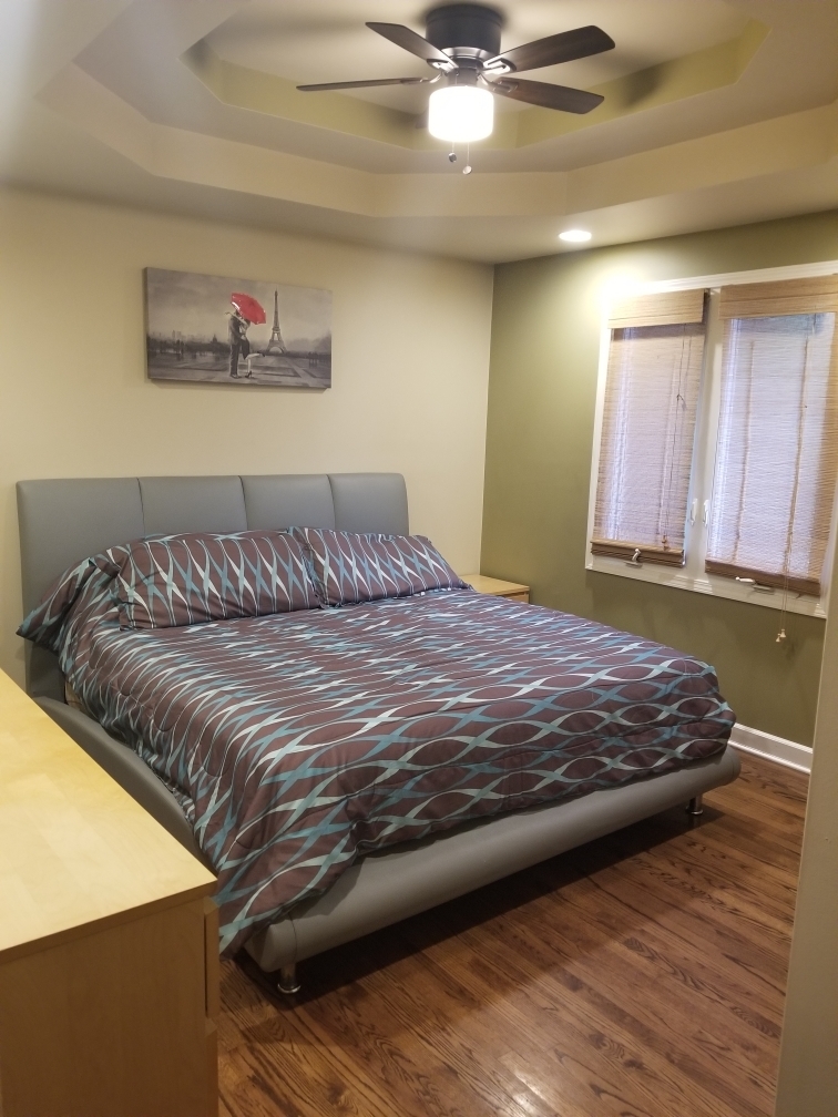 6110 Birmingham Street Chicago Ridge, IL 60415 - Photo 6 of 20 a bedroom with a bed and wooden floor