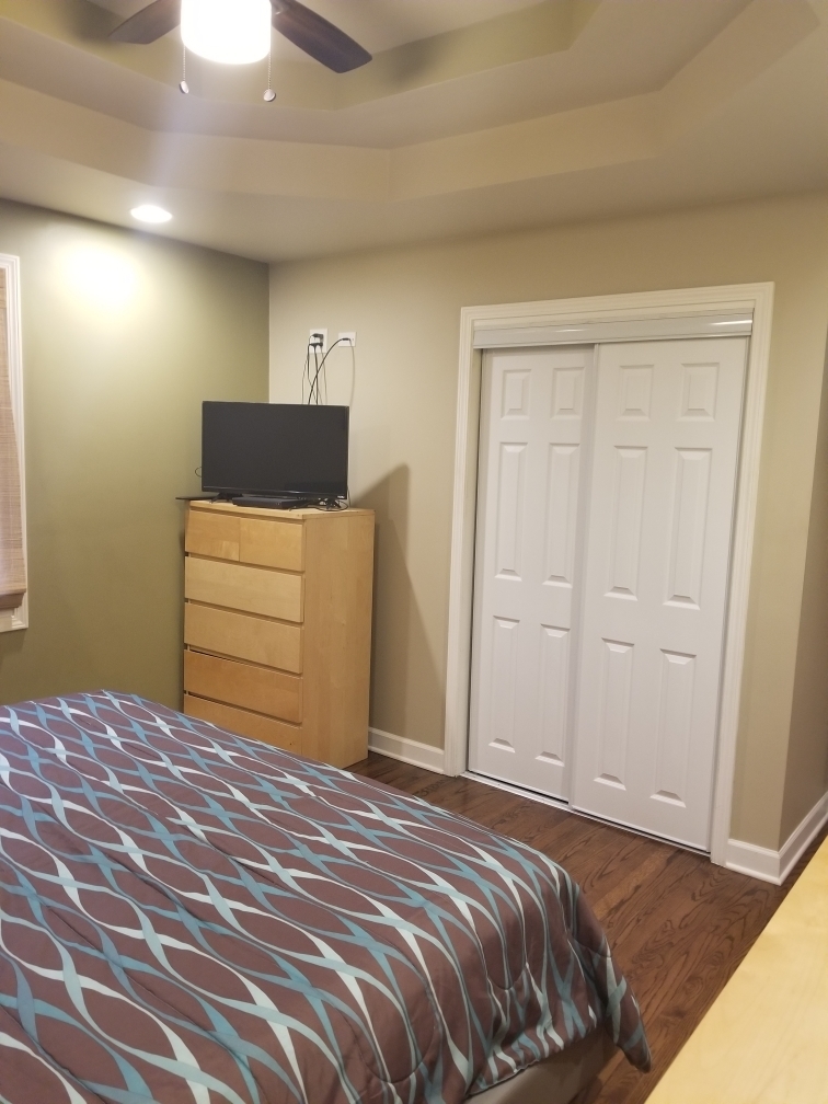 6110 Birmingham Street Chicago Ridge, IL 60415 - Photo 7 of 20 a bedroom with a bed and a cabinets
