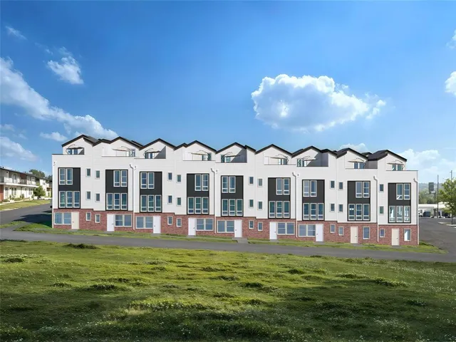 a view of a house with a garden and swimming pool