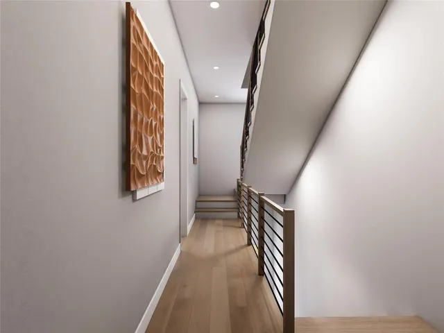 a view of a hallway with stairs