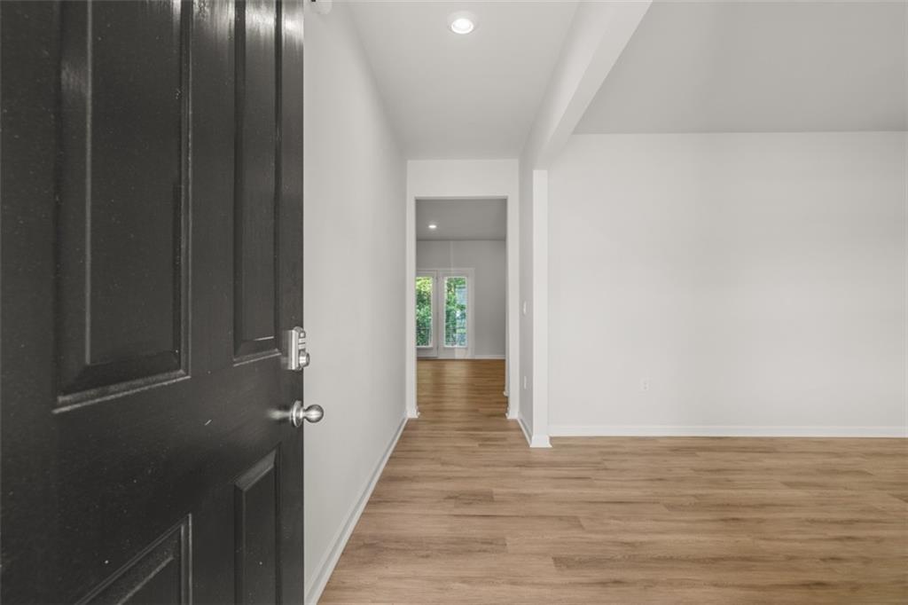509 Oak View Lane Dallas, GA 30157 - Photo 2 of 35 a view of a hallway with wooden floor