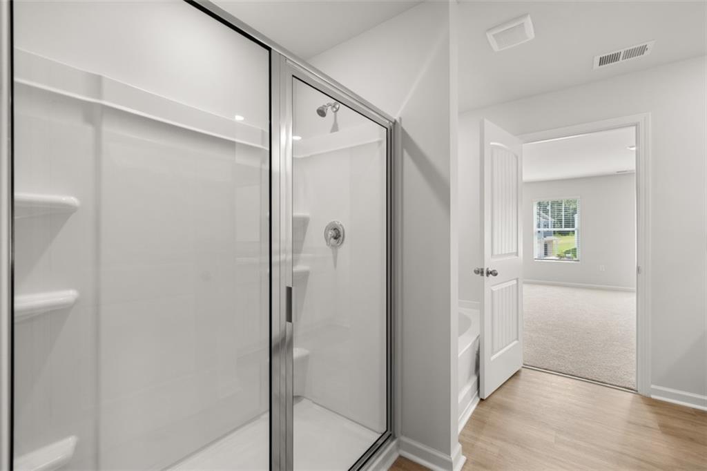 509 Oak View Lane Dallas, GA 30157 - Photo 24 of 35 a bathroom with a shower and a glass door