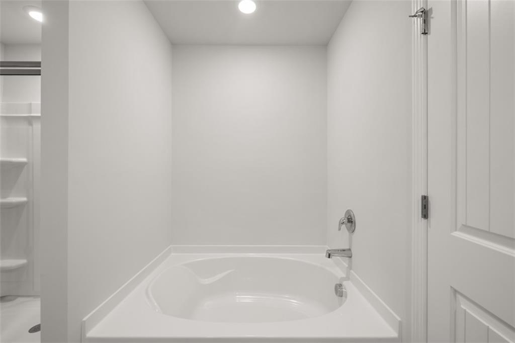 509 Oak View Lane Dallas, GA 30157 - Photo 25 of 35 a close up of a bathtub in a bathroom