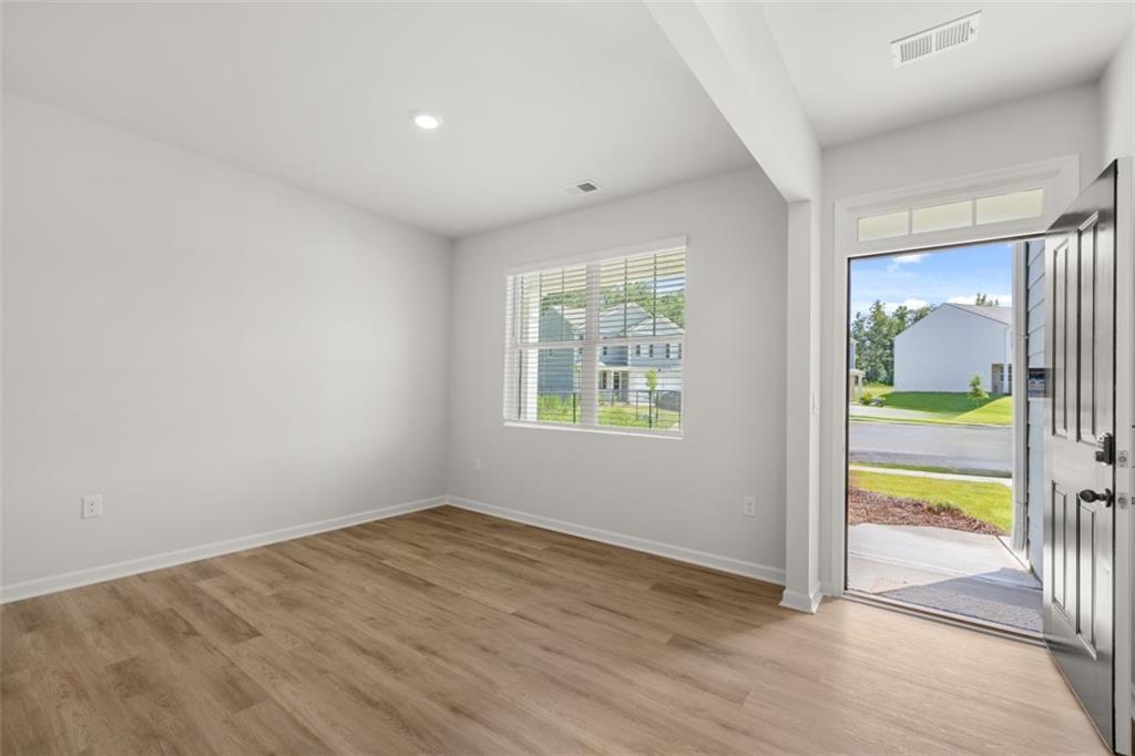 509 Oak View Lane Dallas, GA 30157 - Photo 3 of 35 wooden floor in an empty room with a window