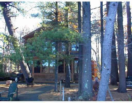 147 Baddacook Pond Road Groton, MA 01450 - Photo 1 of 1 a street view along with trees
