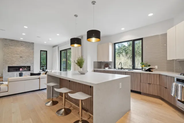 a bedroom with a large bed and a large window