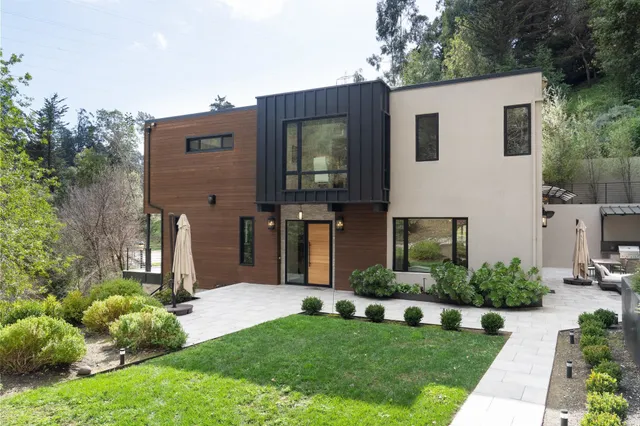 a living room with furniture and view of kitchen
