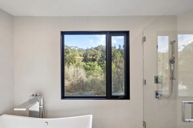 a view of a yard with potted plants
