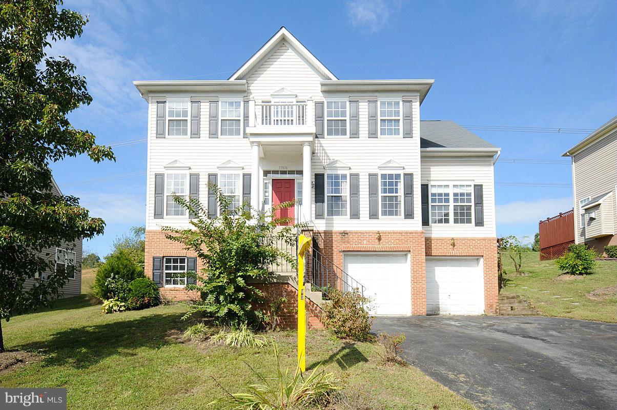 17616 Overlook Road Dumfries, VA 22026 - Photo 1 of 30 a front view of a house with a yard