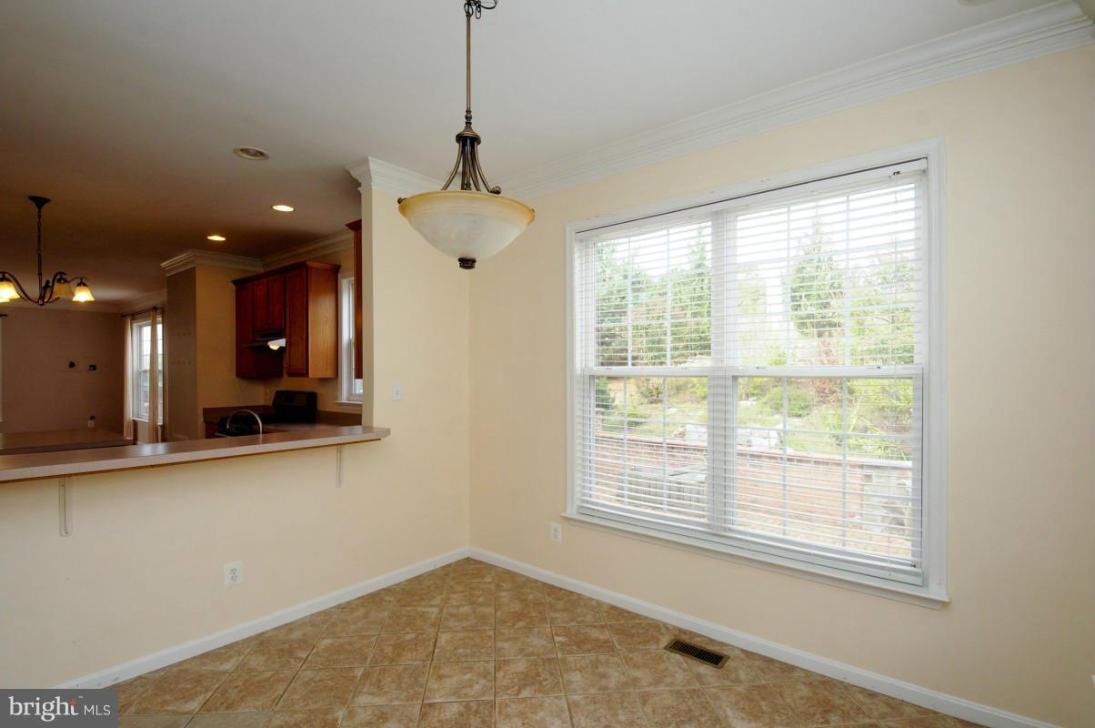 17616 Overlook Road Dumfries, VA 22026 - Photo 15 of 30 a view of a room with a large window and chandelier