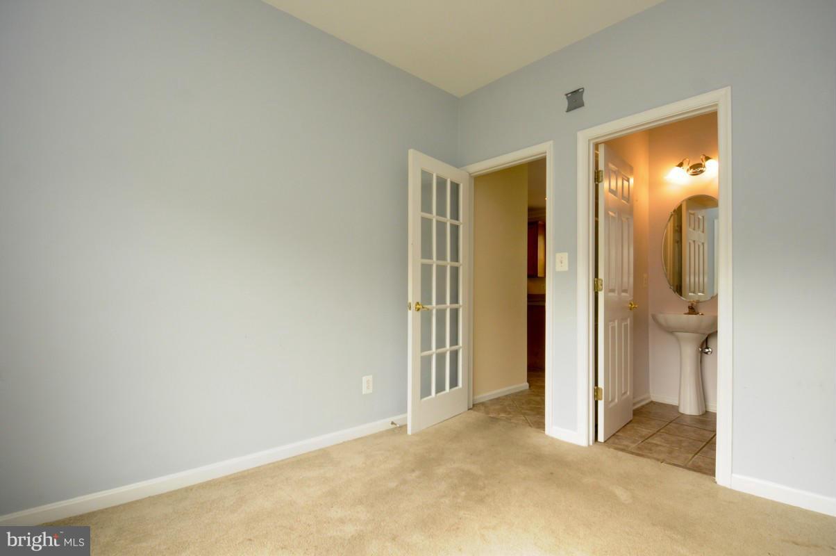 17616 Overlook Road Dumfries, VA 22026 - Photo 19 of 30 a view of an empty room with closet and a bathroom