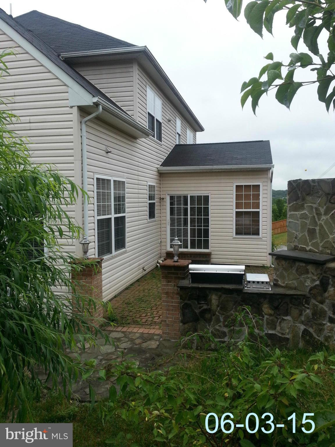 17616 Overlook Road Dumfries, VA 22026 - Photo 28 of 30 front view of a house with a yard