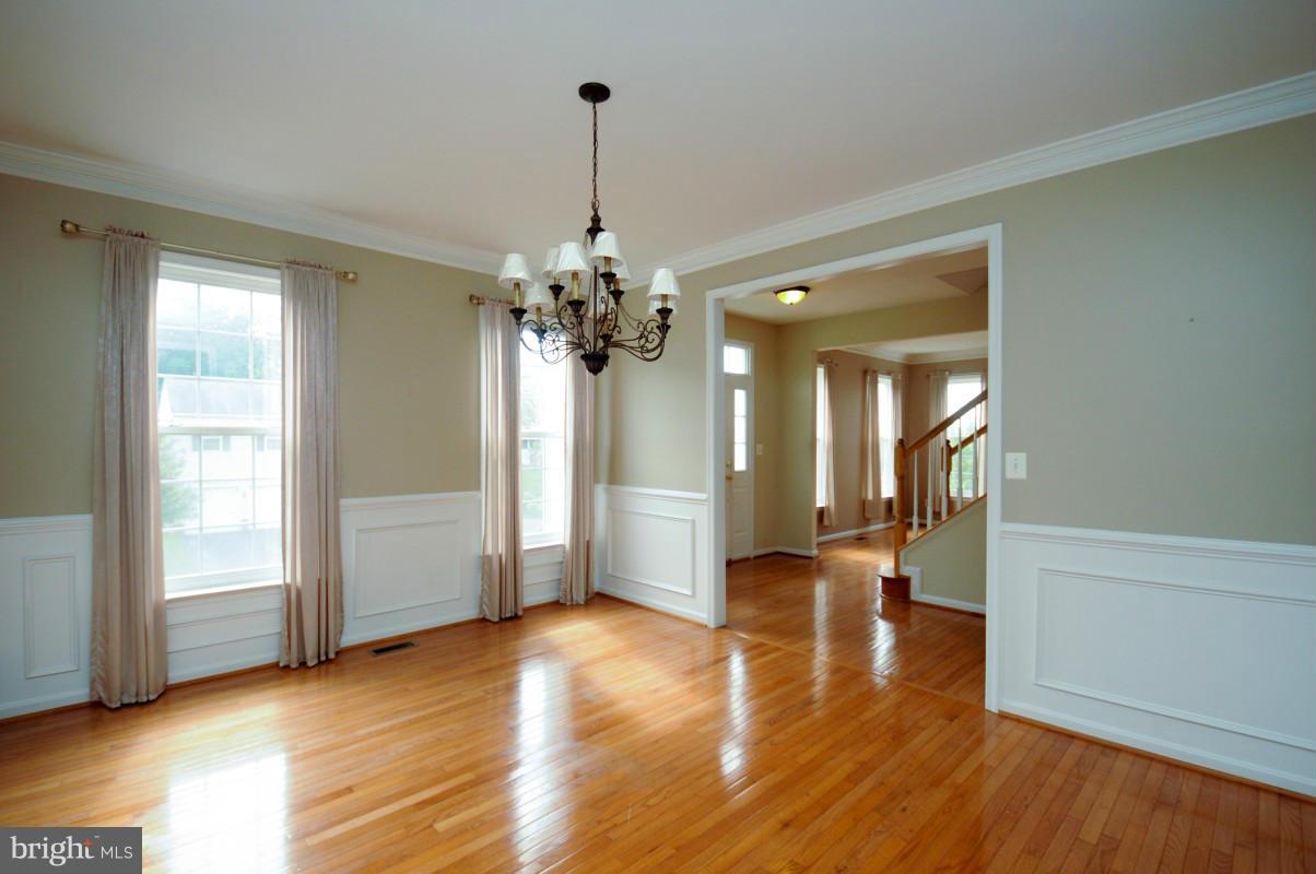 17616 Overlook Road Dumfries, VA 22026 - Photo 8 of 30 a view of a livingroom with a chandelier