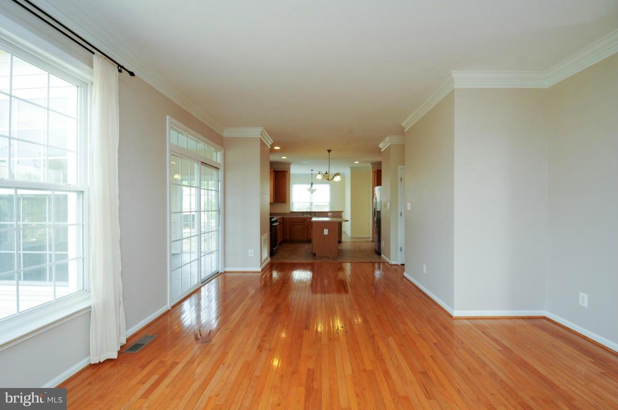 17616 Overlook Road Dumfries, VA 22026 - Photo 10 of 30 a view of a big room with wooden floor and windows
