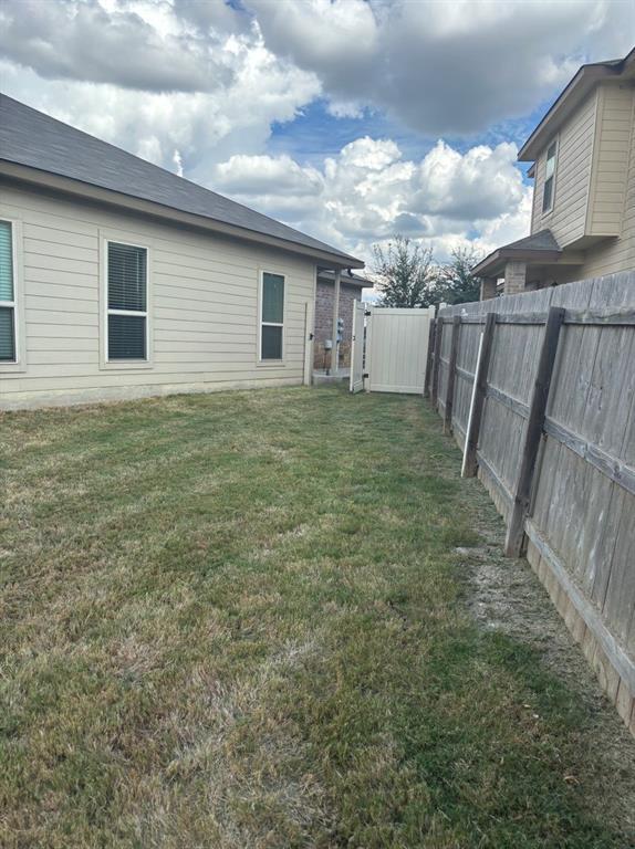 515 Jack Rabbit Lane, Unit A Buda, TX 78610 - Photo 16 of 16 a view of a backyard
