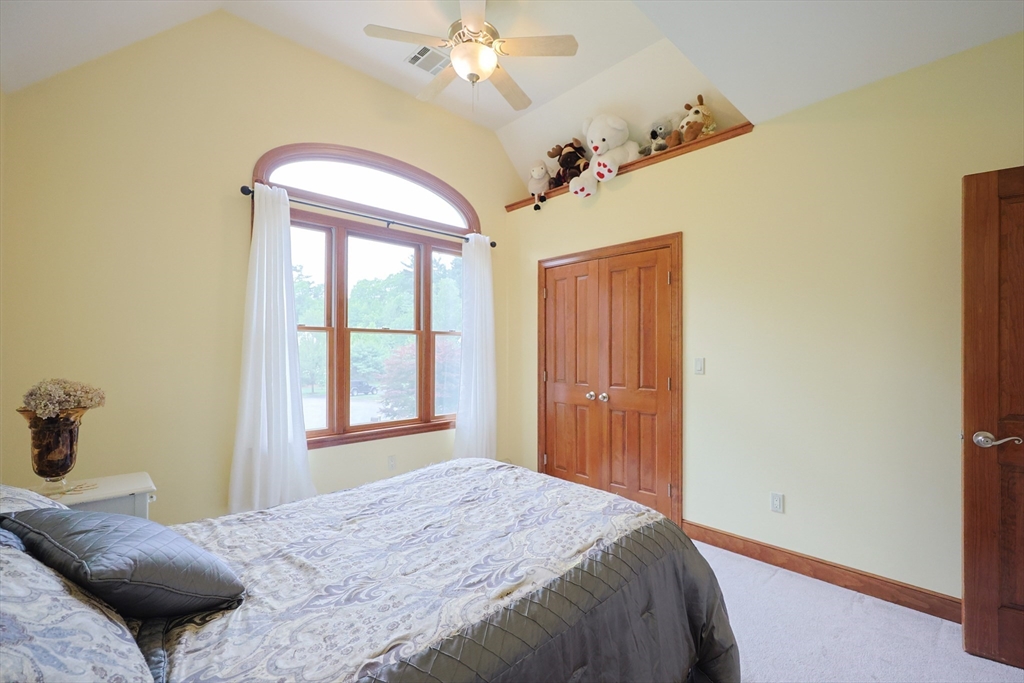 70 Azalea Way Hanson, MA 02341 - Photo 36 of 42 a bedroom with a bed and a window