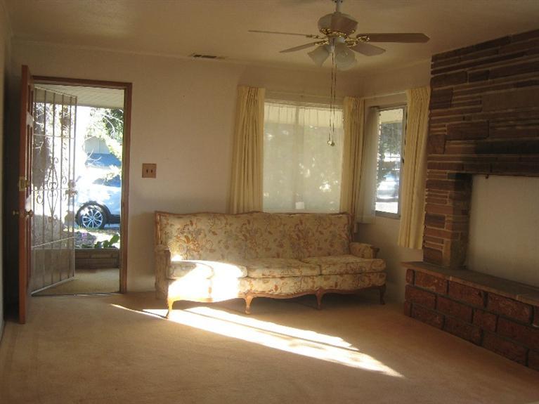 14 Burnham Road Oak View, CA 93022 - Photo 5 of 9 a bedroom with a bed and a chandelier