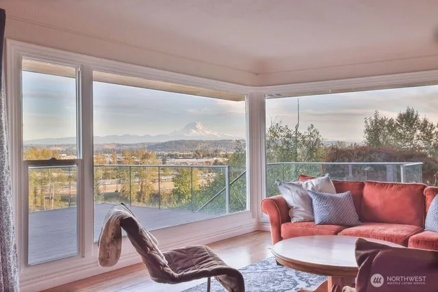 a balcony with furniture and a potted plant