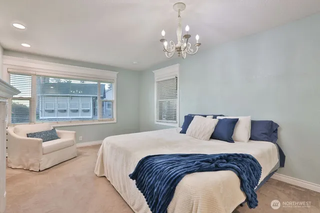 a bedroom with a large bed and a couch