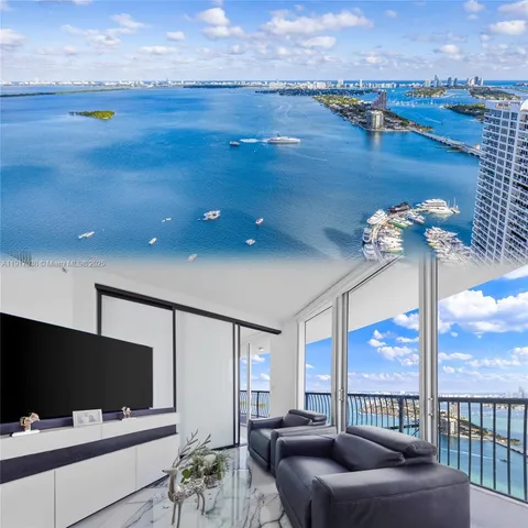 a living room with furniture tv and a floor to ceiling window