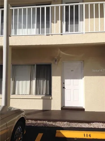 a front view of a house with a swimming pool