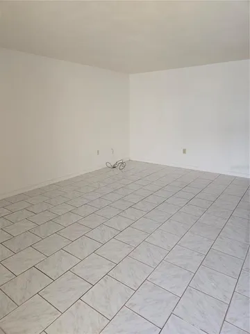 a kitchen with a refrigerator stove and cabinets