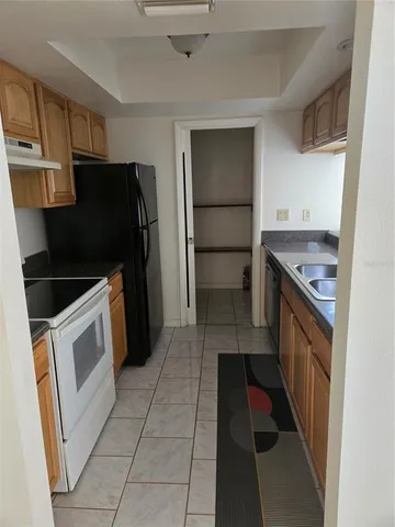 a view of an empty room and a window