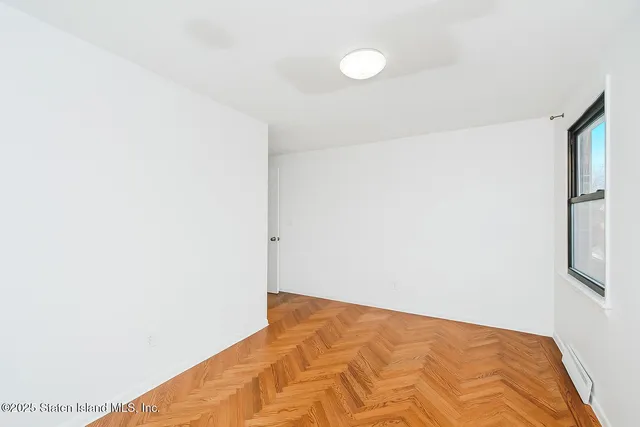 an empty room with white walls