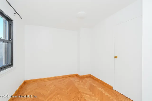 a view of a small space with wooden floor