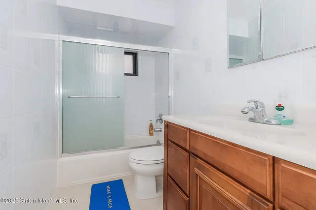 a bathroom with a tub and sink