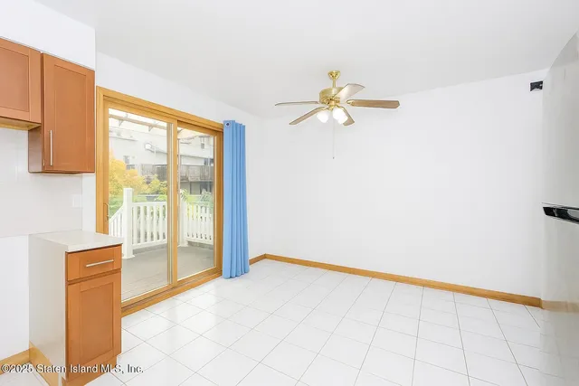 a view of a kitchen with wooden cabinet and a fireplace