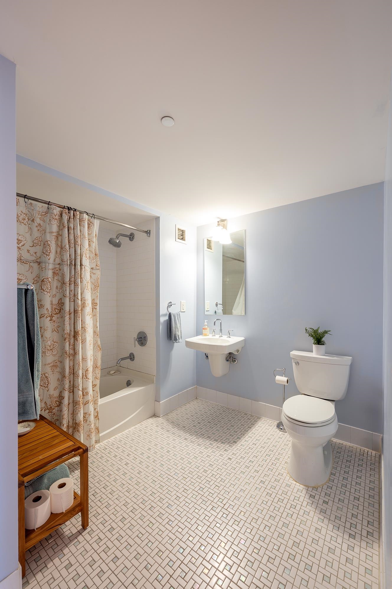 700 Grove Street, Unit 10A Jersey City, NJ 07310 - Photo 19 of 24 a bathroom with a sink toilet and shower