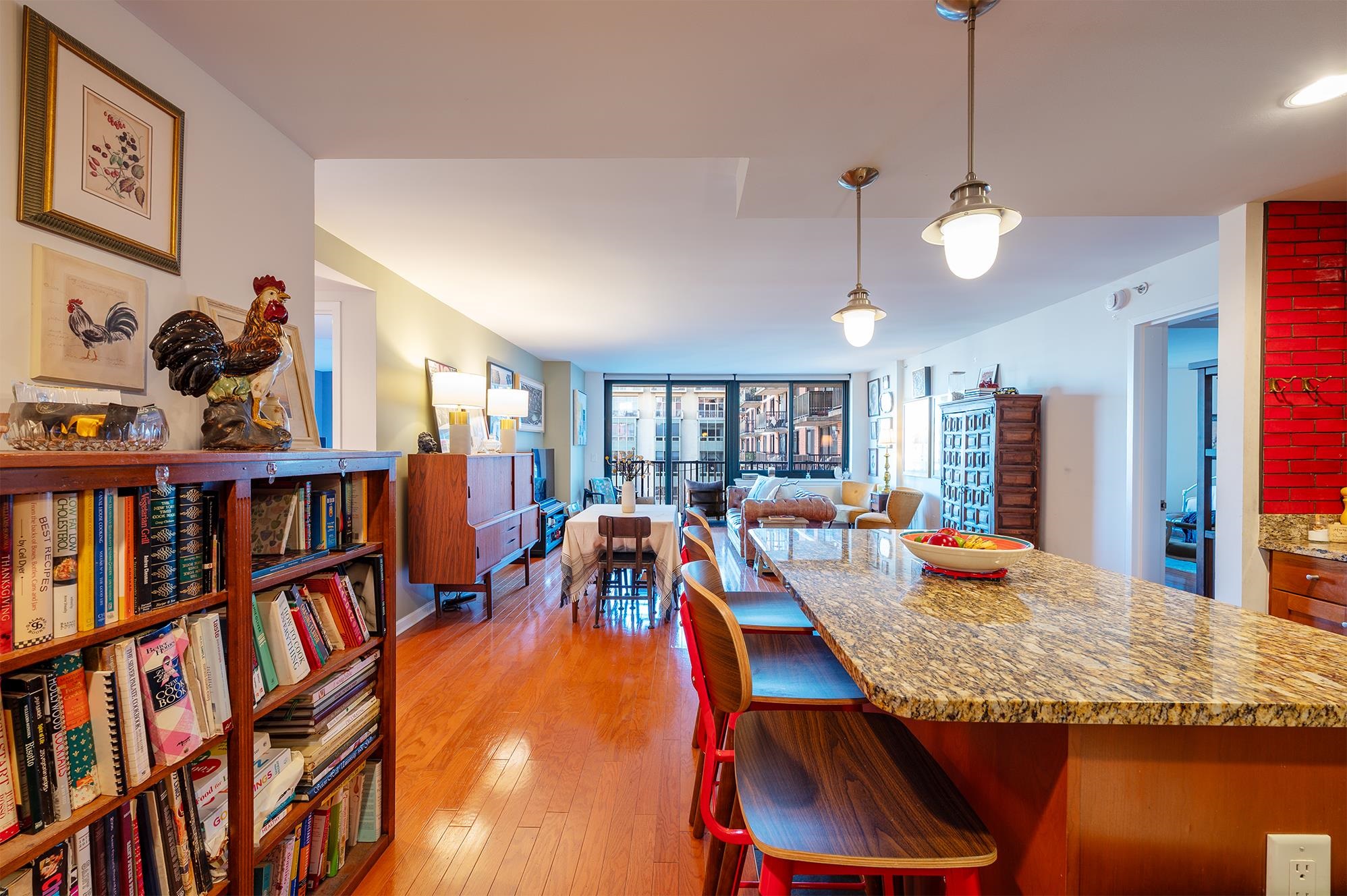 700 Grove Street, Unit 10A Jersey City, NJ 07310 - Photo 4 of 24 a large living room with lots of furniture and a book