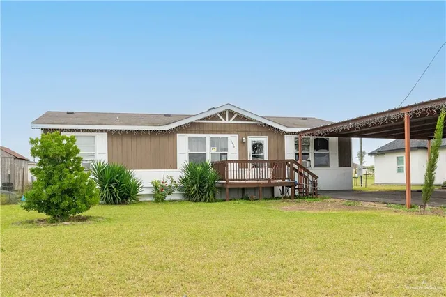 a view of a house with swimming pool and porch with furniture