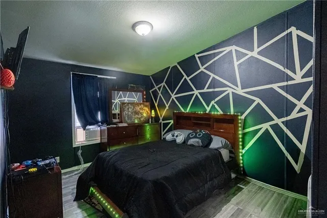 a bed sitting in a room next to a window