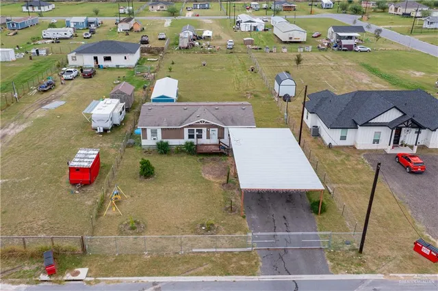 a aerial view of a house with outdoor space