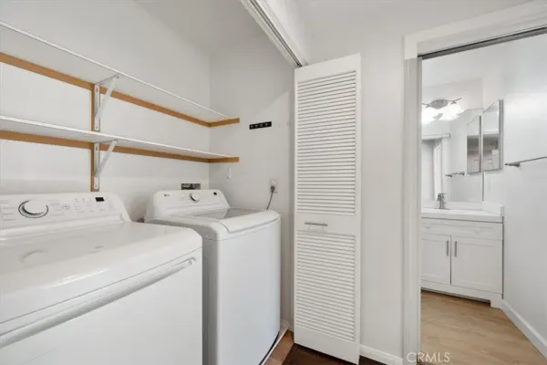 a view of a hallway with a ceiling fan