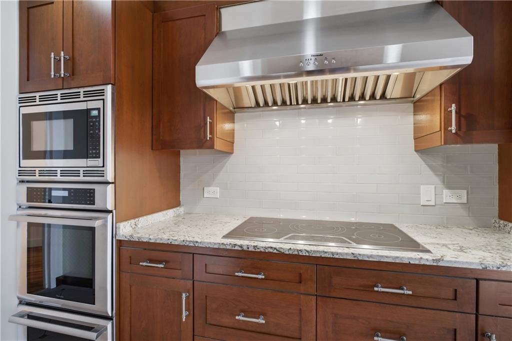 2660 Peachtree Road Northwest, Unit 9G Atlanta, GA 30305 - Photo 14 of 42 a stove top oven sitting inside of a kitchen
