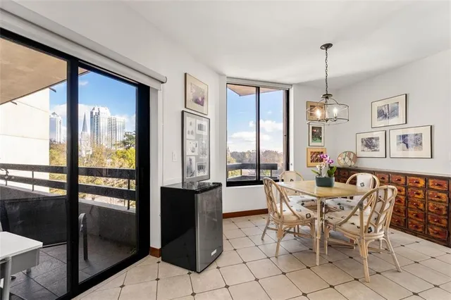 a view of a dining room with furniture window and outside view