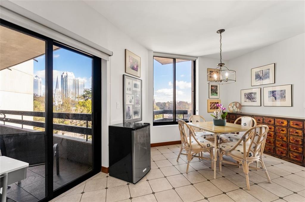 2660 Peachtree Road Northwest, Unit 9G Atlanta, GA 30305 - Photo 17 of 37 a view of a dining room with furniture window and outside view